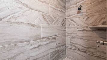 Shower, hair dryer, towels, toilet paper