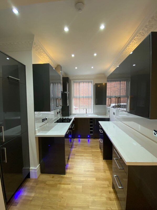 Enjoy cooking in this well-equipped kitchen with appliances, ample counter space, and a central island.