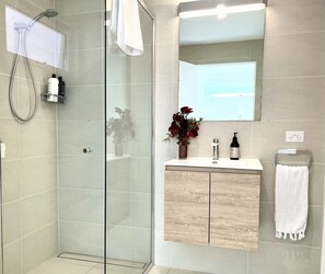 Shower, hair dryer, towels, soap