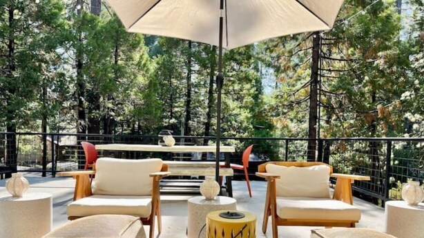 An outdoor seating area with a table, chairs, and a decorative lamp. - Good Life Cabin- EV-Hot Tub-Lake Access-Pups OK (Arnold)