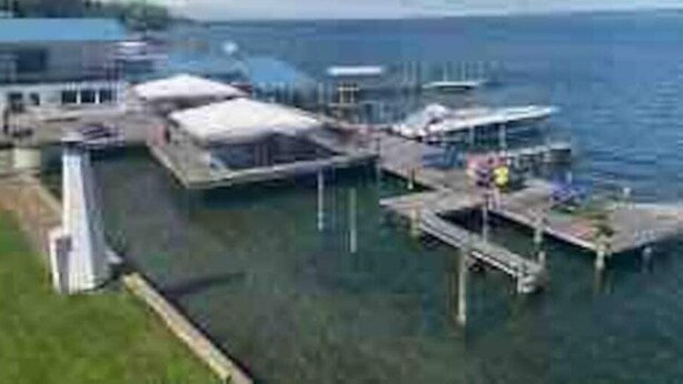 A marina with multiple docks and boats. - Seneca Lake View Retreat sits secluded on a 2 acre lot. (Himrod)