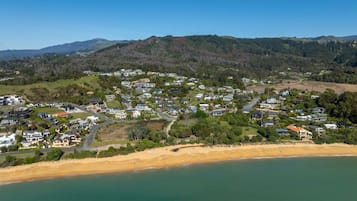 A coastal residential area with houses and a beach.