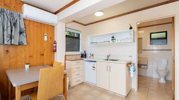 Microwave, coffee/tea maker, toaster, cookware/dishes/utensils