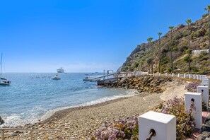 On the beach, beach towels - Hamilton Cove Condo with Golf Cart and Close to Beach. Only 24 Steps to Door. (Avalon)