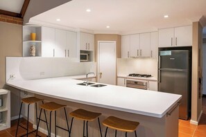 Coffee/tea maker, fridge, microwave, oven