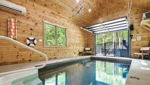 A wooden cabin with a pool, a lifebuoy, and a slide. - Modern cabin w/heated pool & hot tub next to pkwy (Sevierville)