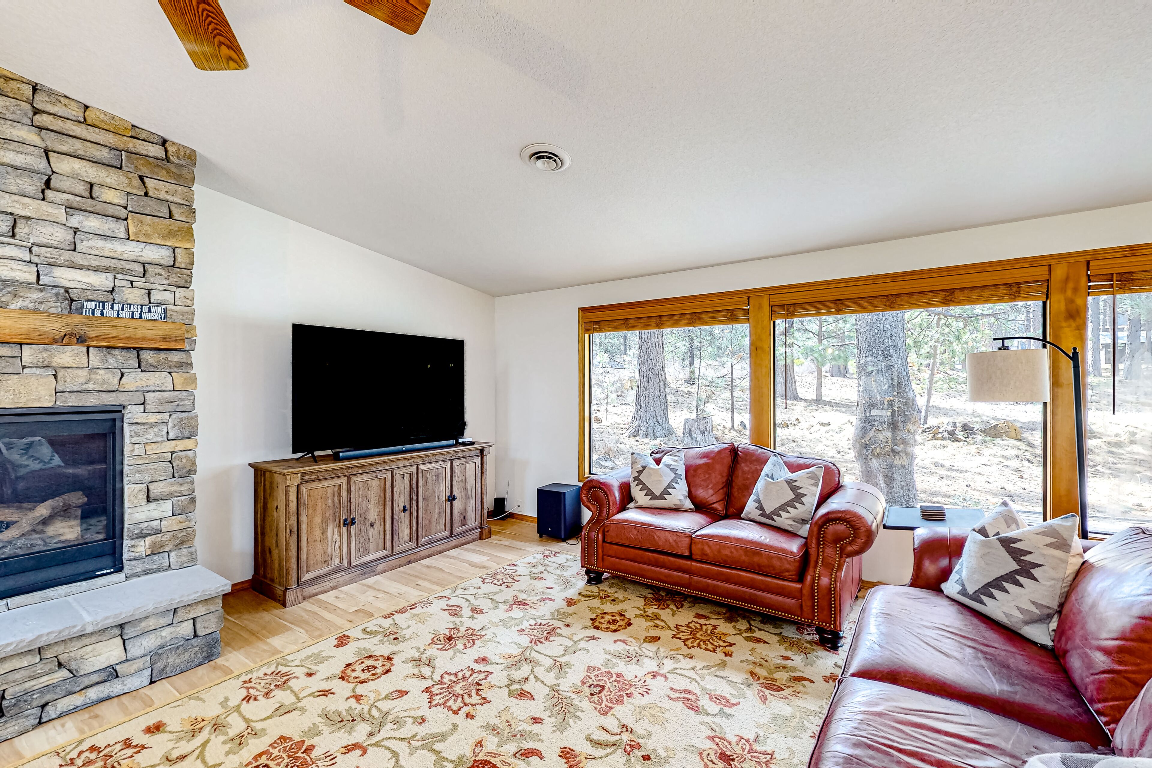 Charming, single-level retreat with a gas fireplace, AC, washer/dryer, & SHARC