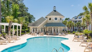 A pool area with lounge chairs and a gazebo. - Golf Course Condo with Resort Style Pool, 5 Miles from Beach, Fully updated (Myrtle Beach)