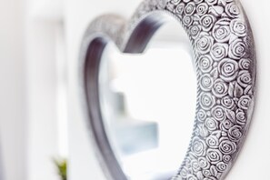 A heart-shaped wall decoration with a floral pattern. - Willow Chalet (Grange-over-Sands)