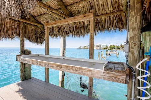 Modern waterfront condo with pool, shared dock, & W/D - snowbird-friendly