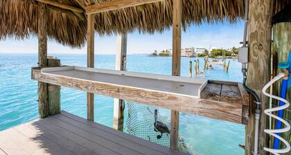 Modern waterfront condo with pool, shared dock, & W/D - snowbird-friendly