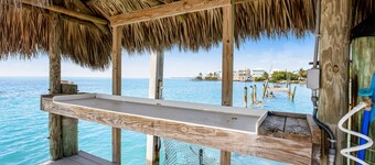 Modern waterfront condo with pool, shared dock, & W/D - snowbird-friendly