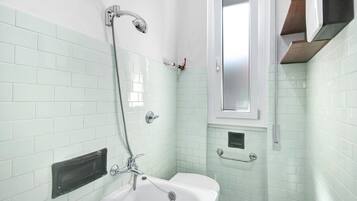 Bathtub, hair dryer, towels