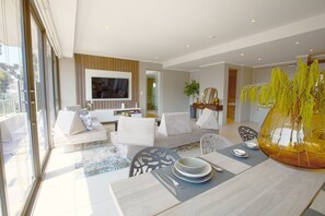 65-inch Smart TV with satellite channels - Azalia Apartments (Sandton)