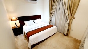 Apartamento familiar | 2 dormitorios, cortinas opacas, tabla de planchar con plancha