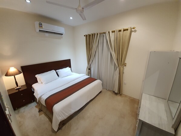 Apartemen Keluarga | 2 kamar tidur, tirai kedap cahaya, dan setrika/meja setrika