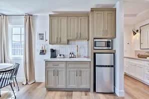 Fridge, microwave, coffee/tea maker, toaster