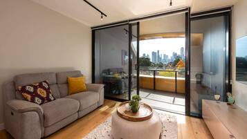 Basic Apartment, Multiple Beds | Living area | TV