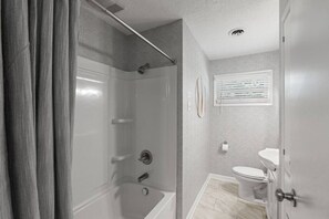 Hair dryer, towels, shampoo, toilet paper