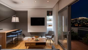Panoramic Apartment, 1 Bedroom, Terrace, City View | Living area | 50-inch Smart TV with cable channels, TV