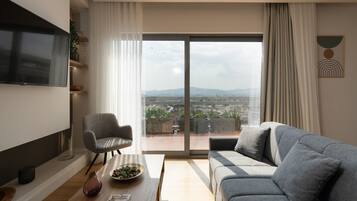 Panoramic-Apartment, 1 Schlafzimmer, Terrasse, Stadtblick | Wohnbereich