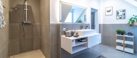 Shower, hair dryer, towels, soap