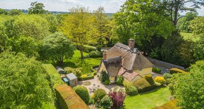 The Gildhall is a charming thatched cottage sleeps six guests