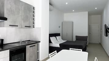 Comfort Apartment | Living area | 42-inch Smart TV with cable channels, TV, Netflix
