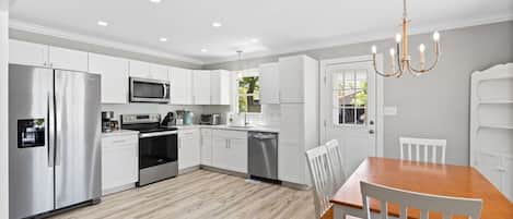 Fridge, stovetop, dishwasher, coffee/tea maker
