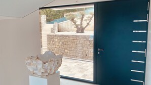 A modern interior with a large sliding glass door leading to an outdoor area. - 5 Luxury Contemporary Villa With Pool & Seaview - Lavender Boka Hill -brand new (Podi)