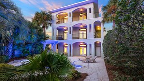 A multi-story hotel with balconies, a pool area, and lush landscaping. - Gulf Views | Pool | Close to Beach | Elevator (Santa Rosa Beach)