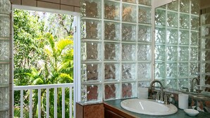 A bathroom with a large window, a sink, and a mirror. - Sea Turtle Villa: Stunning Views! Newly Refurnished! (St John)