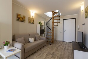 Comfort Apartment | Living area | 43-inch flat-screen TV with digital channels, TV