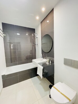 Bathtub, hair dryer, towels