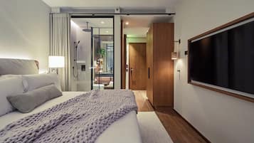 Ropa de cama hipoalergénica, minibar, caja fuerte