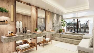 Sink, mirrors, and a bench provide a convenient space for grooming and relaxation.