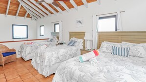 A hotel room with two beds, a wooden ceiling, and a window. - 2 Bedroom Oceanview Villa w/ Pool & Courtyard – St. John (Cruz Bay)