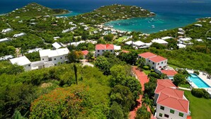 A coastal resort with multiple buildings, a swimming pool, and clear views of the ocean and nearby islands. - 2 Bedroom Oceanview Villa w/ Pool & Courtyard – St. John (Cruz Bay)