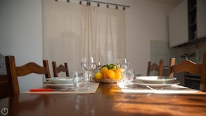 Enjoy a romantic dinner for two in this cozy dining area with a beautifully set table.