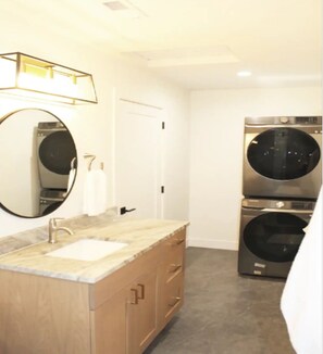 Bathroom with stacked washer/dryer