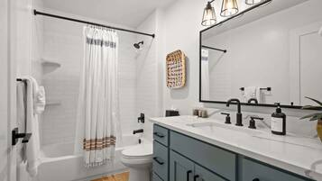 Bathtub, hair dryer, towels