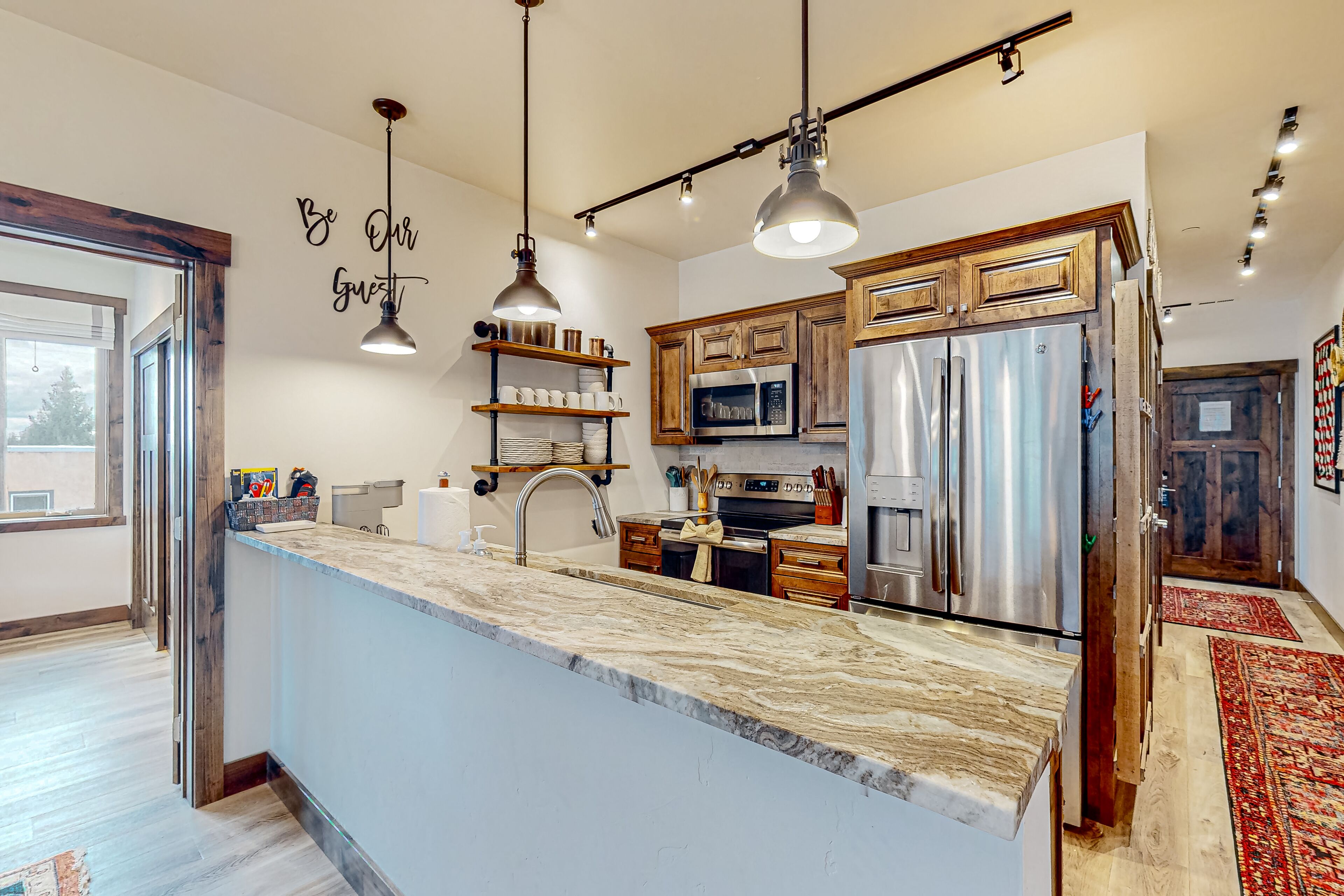 Brand-new downtown condo with rooftop patio, grill, mtn views, fireplace, & W/D