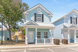 A two-story house with a porch, a mailbox, and a small tree. - Wonderful Cottage by the Soft Sand Beach (Myrtle Beach)