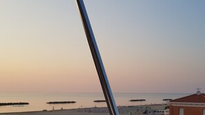 A coastal view with buildings and a clear sky. - Attic room by the sea (Porto San Giorgio)