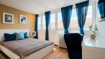 1 bedroom, desk, iron/ironing board, travel crib