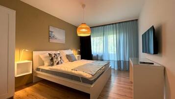 1 bedroom, desk, iron/ironing board, travel crib