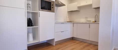 Fridge, microwave, stovetop, coffee/tea maker