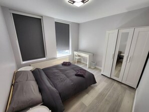 Apartemen, Beberapa Tempat Tidur | 2 kamar tidur, setrika/meja setrika, Wi-Fi gratis, dan seprai linen