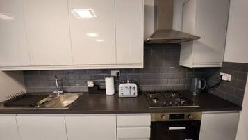 Apartment, Multiple Beds | Private kitchen | Fridge, oven, stovetop, dishwasher