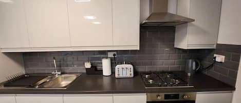Apartment, Multiple Beds | Private kitchen | Fridge, oven, stovetop, dishwasher